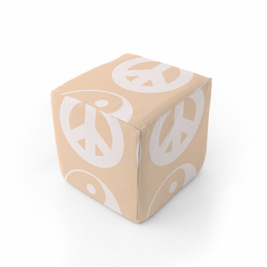 Beige cube with white peace symbol prints on a white background