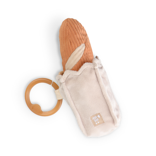Baguette baby teether with brown handle and beige plush body on a white background