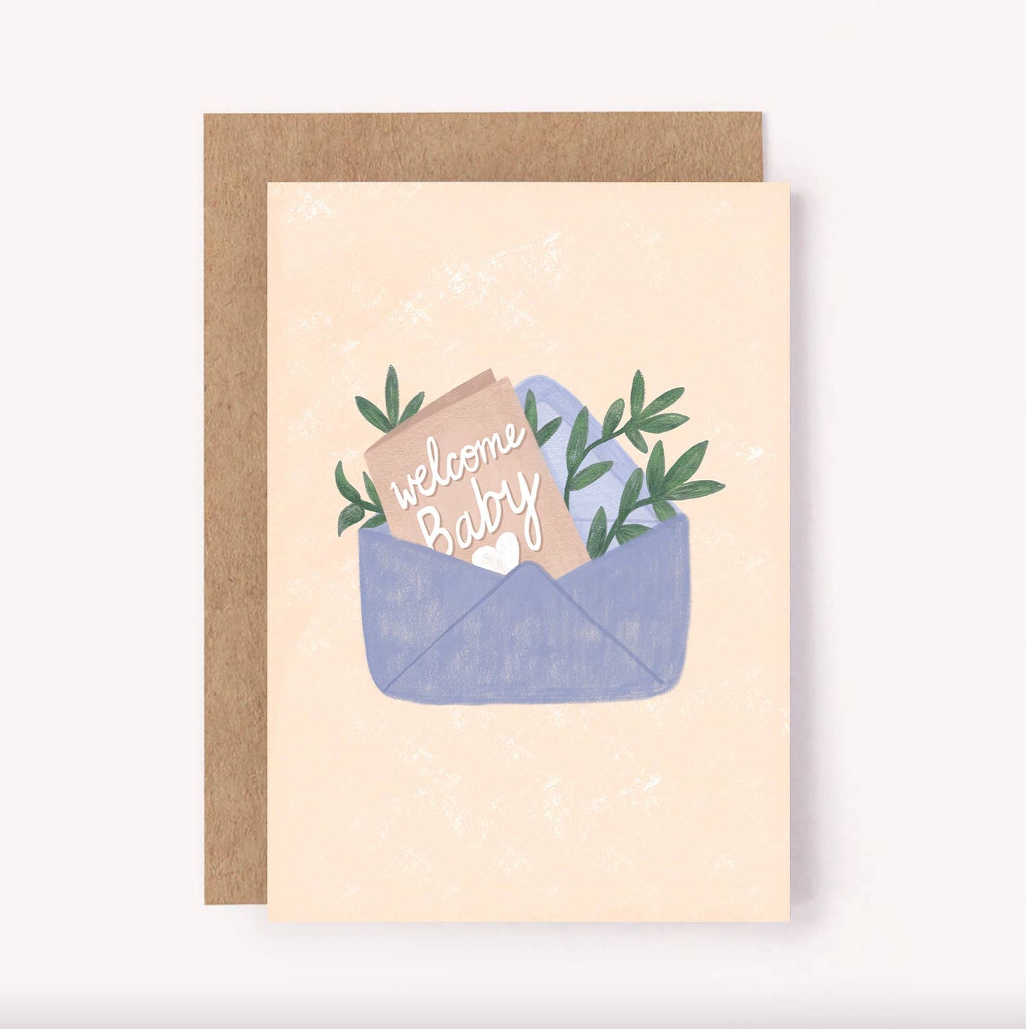 A greeting card with a 'Welcome Baby' text and some foliage designs on a beige background, paired with a brown envelope.