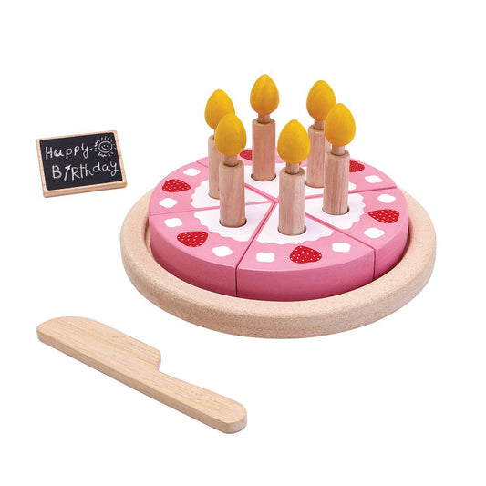 Wooden birthday cake toy with candles and a knife on a white background