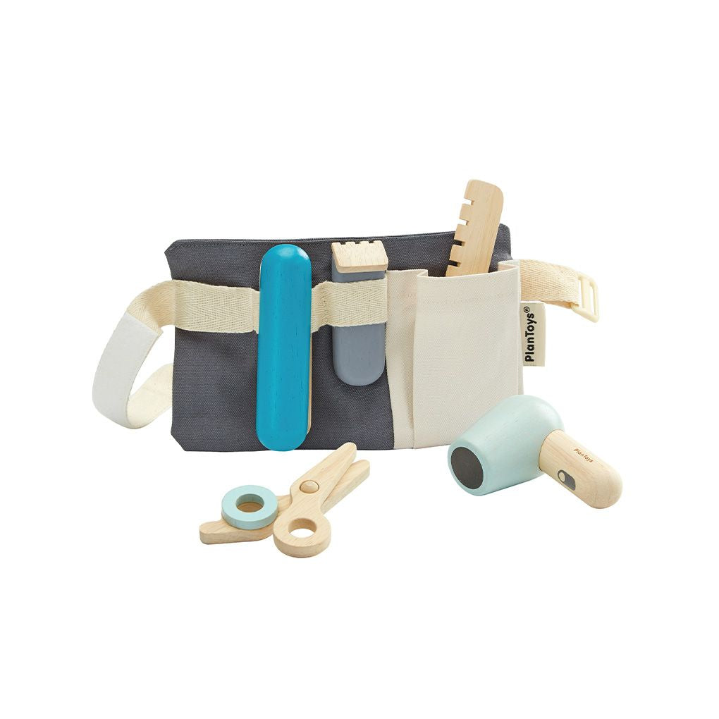 Toy tool belt with various tools on a white background