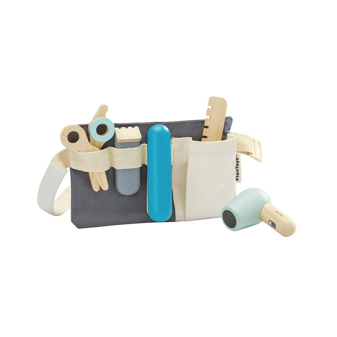 Toy tool set with various tools on a white background