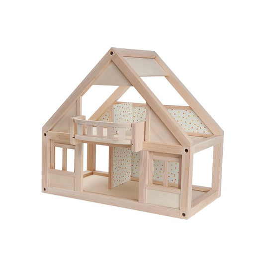 Wooden dollhouse with a balcony on a white background