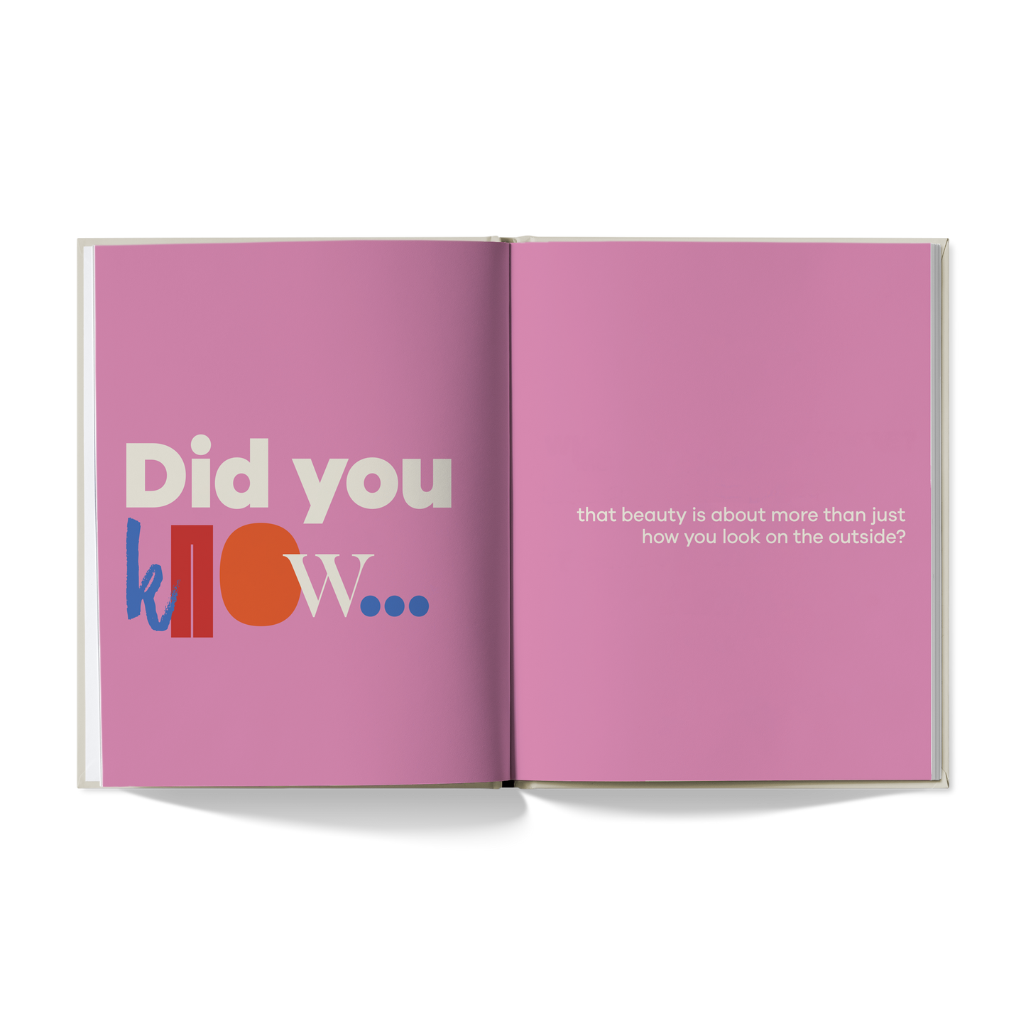 Open book with pink pages displaying text on a white background