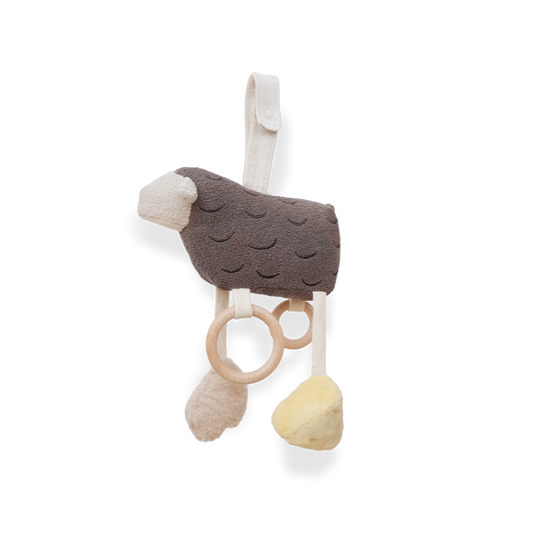 Baby teething toy with soft textures and wooden ring on a white background