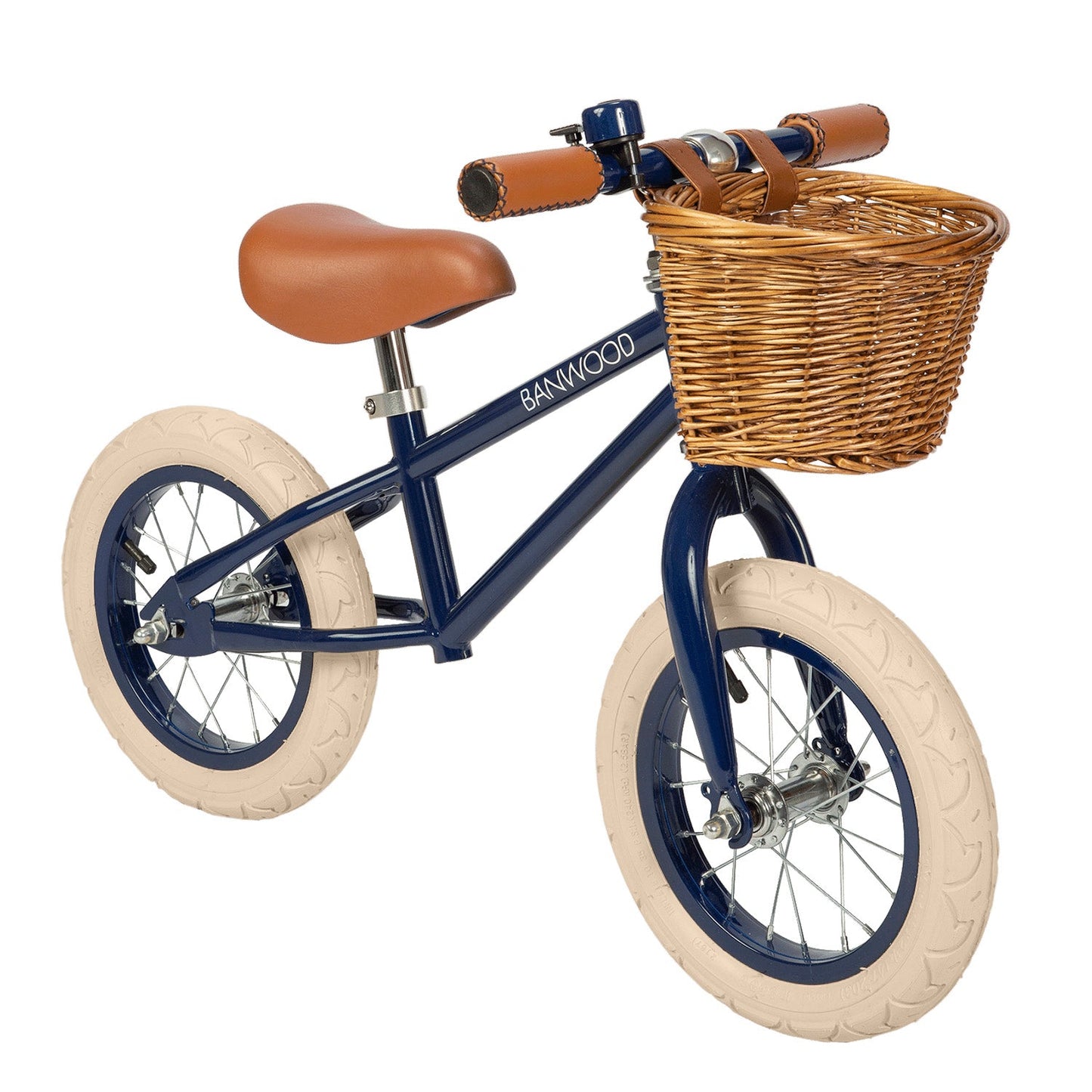 Children's balance bike with a basket on a white background