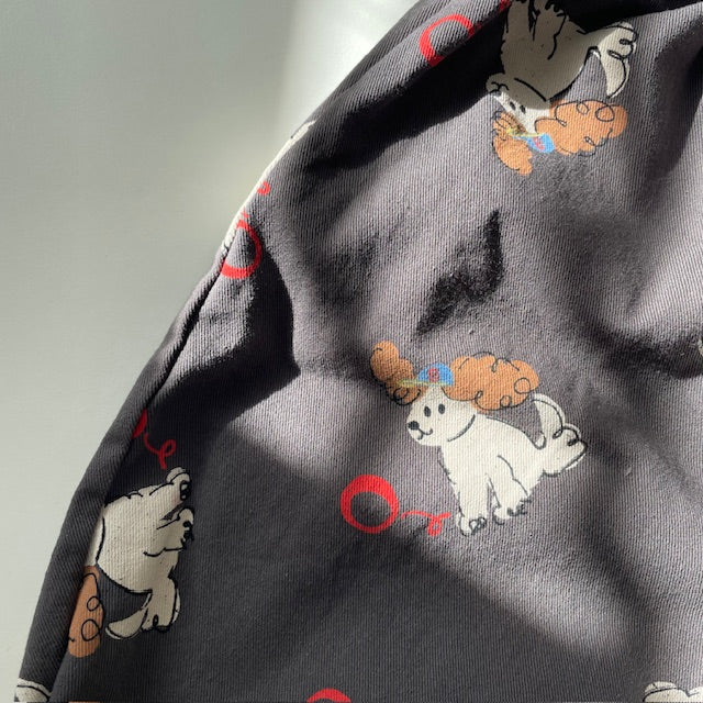 Close up of balloon trouser pants with puppy print in Charcoal.