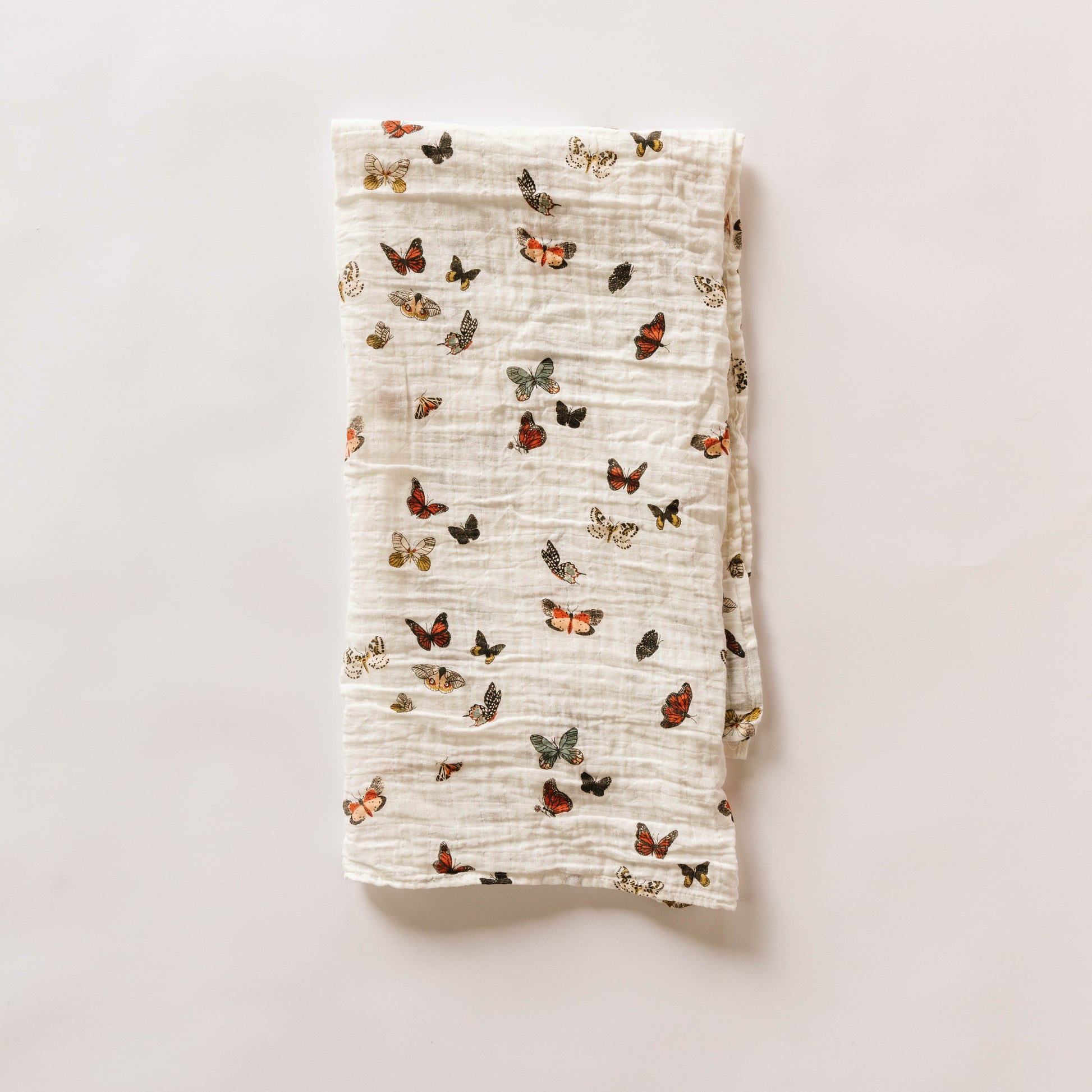 Folded fabric with butterfly pattern on a light background