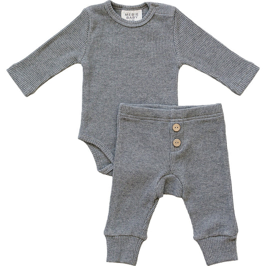 Gray baby outfit with long-sleeve bodysuit and pants on a white background