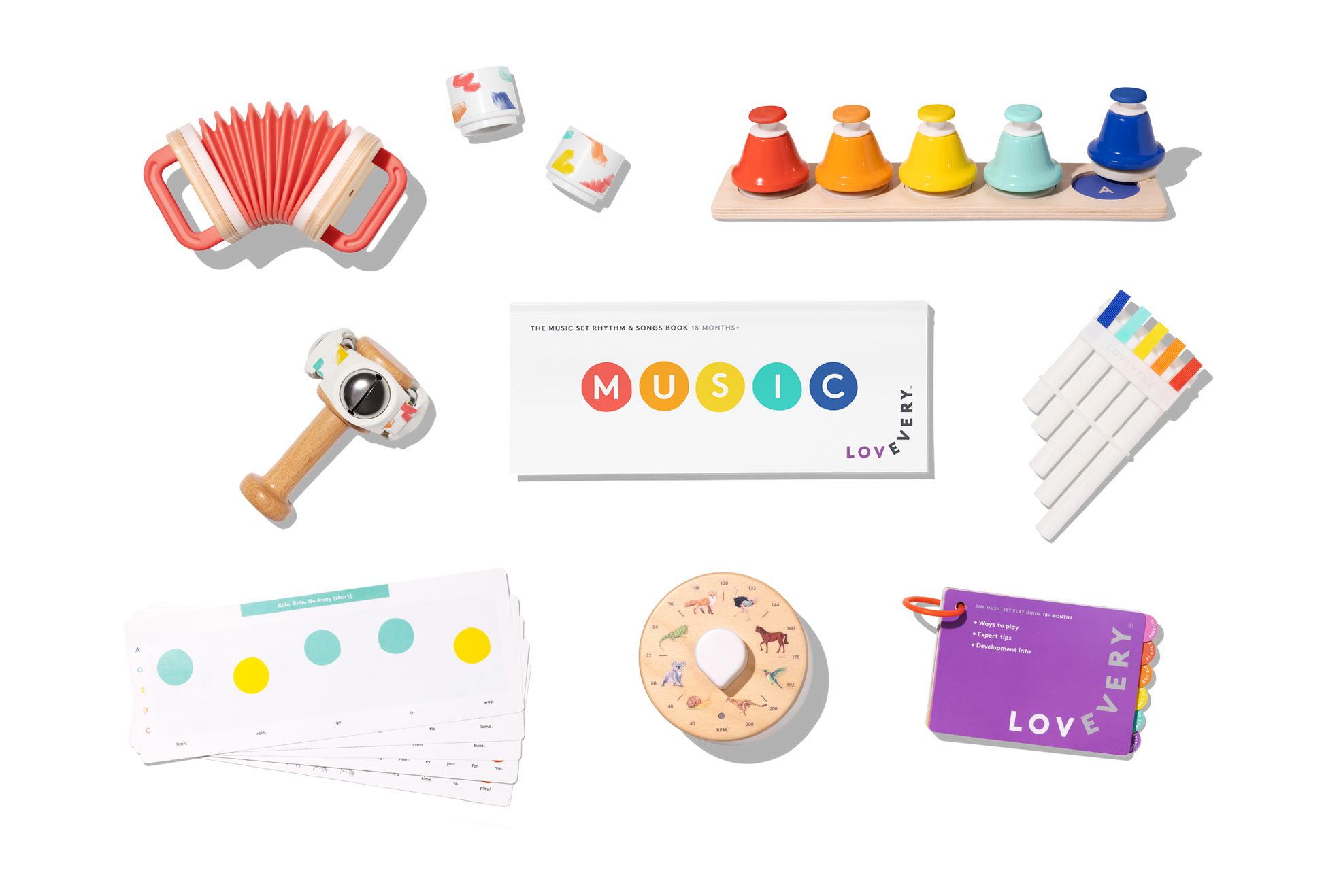 Collection of educational toys and materials for music learning on a white background
