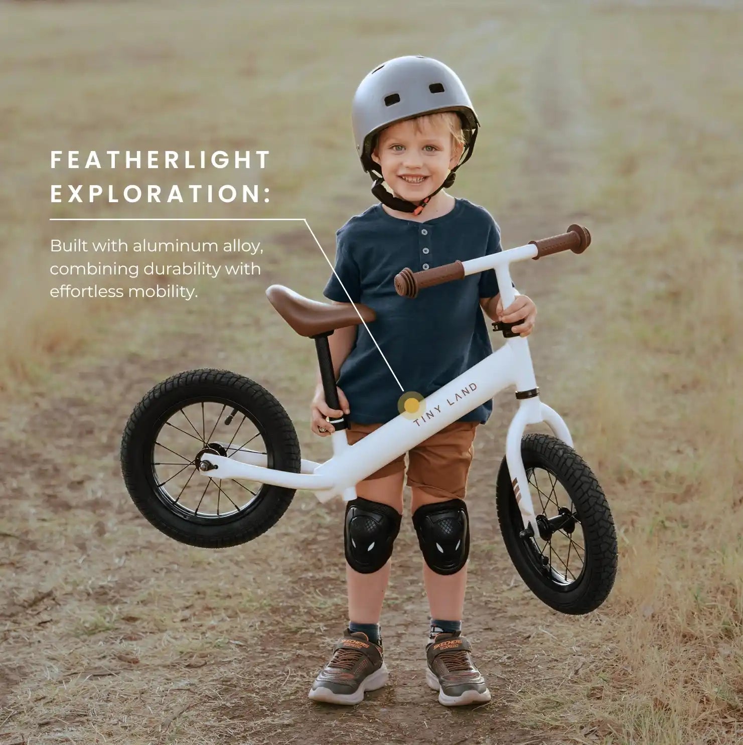 Child holding a balance bike with text about featherlight exploration and durability.