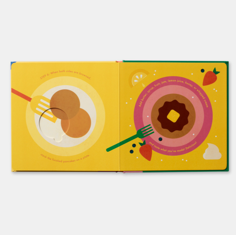 Illustrated book open to pages with donuts and a fork on a yellow background