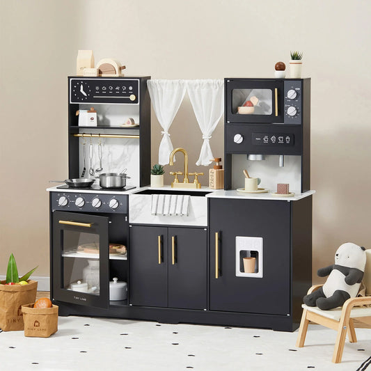 Children's play kitchen set with various appliances and accessories on a neutral background.