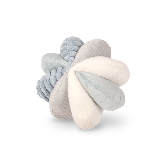 Textured baby rattle toy in gray and white on a white background