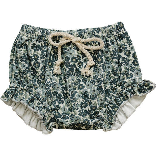 Floral patterned shorts with ruffles on a white background