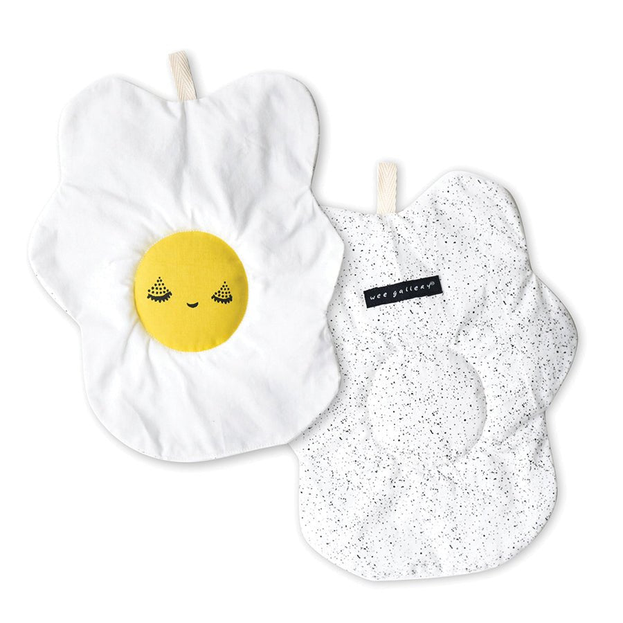 Two crinkly egg design toys with yellow smiley face design and the other with a speckled pattern, on a white background.