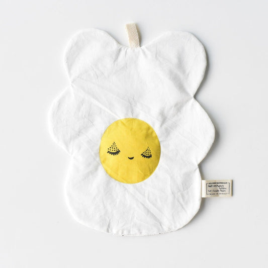 Crinkle egg toy with yellow smiley face design on a white background