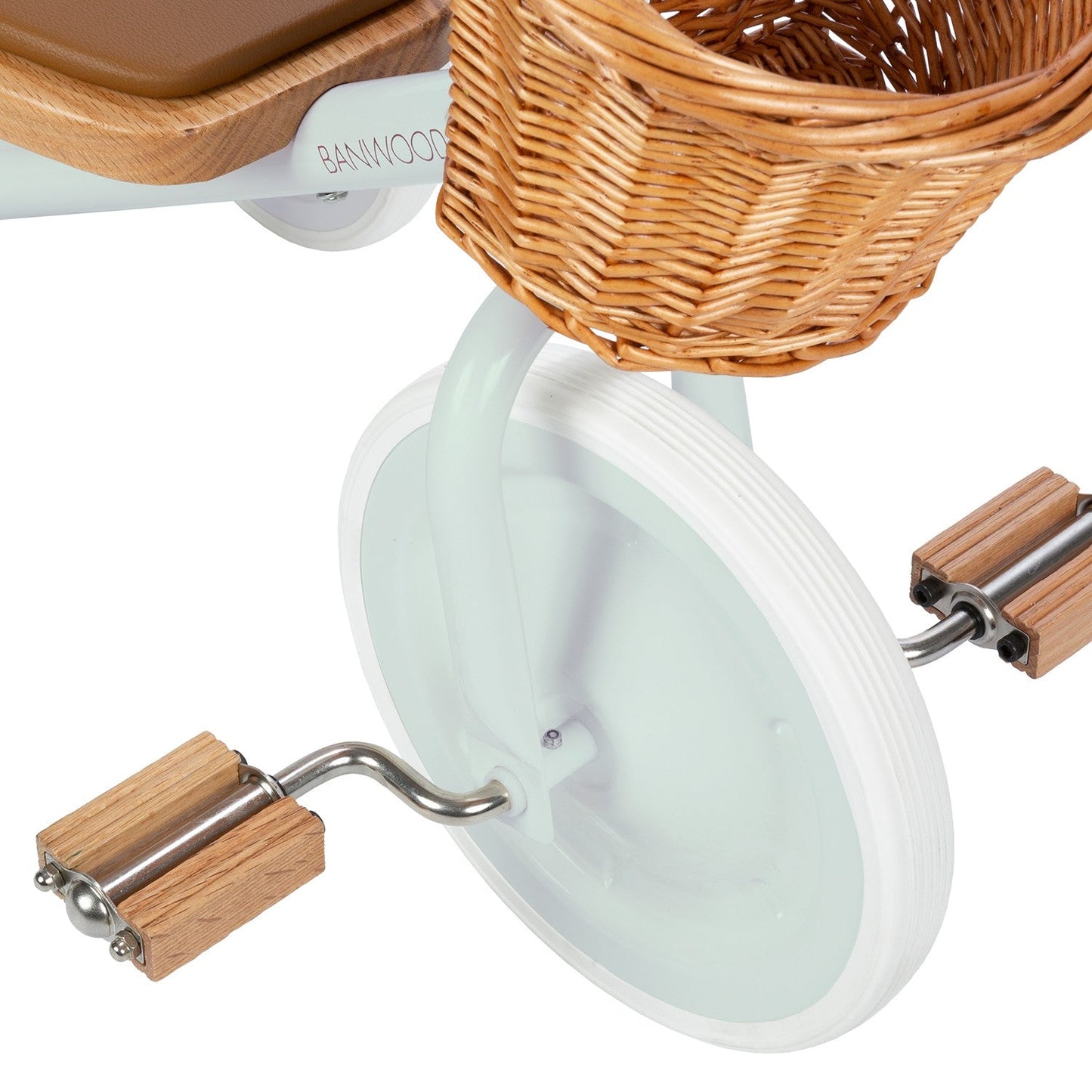 Up close tricycle with wicker basket on a white background