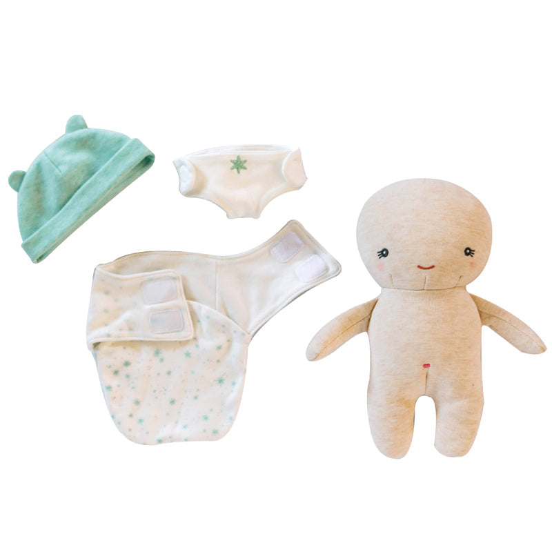 Baby clothing and toy set including a hat, diaper, and plush toy on a white background