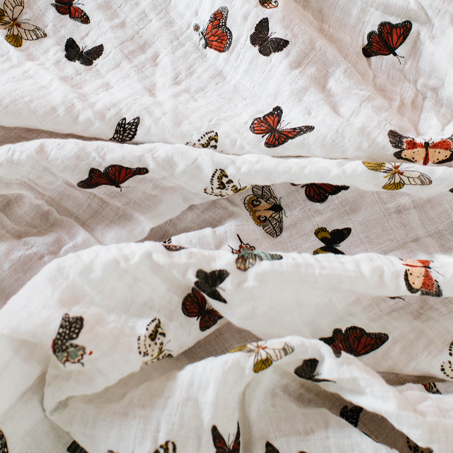 White fabric with colorful butterfly pattern