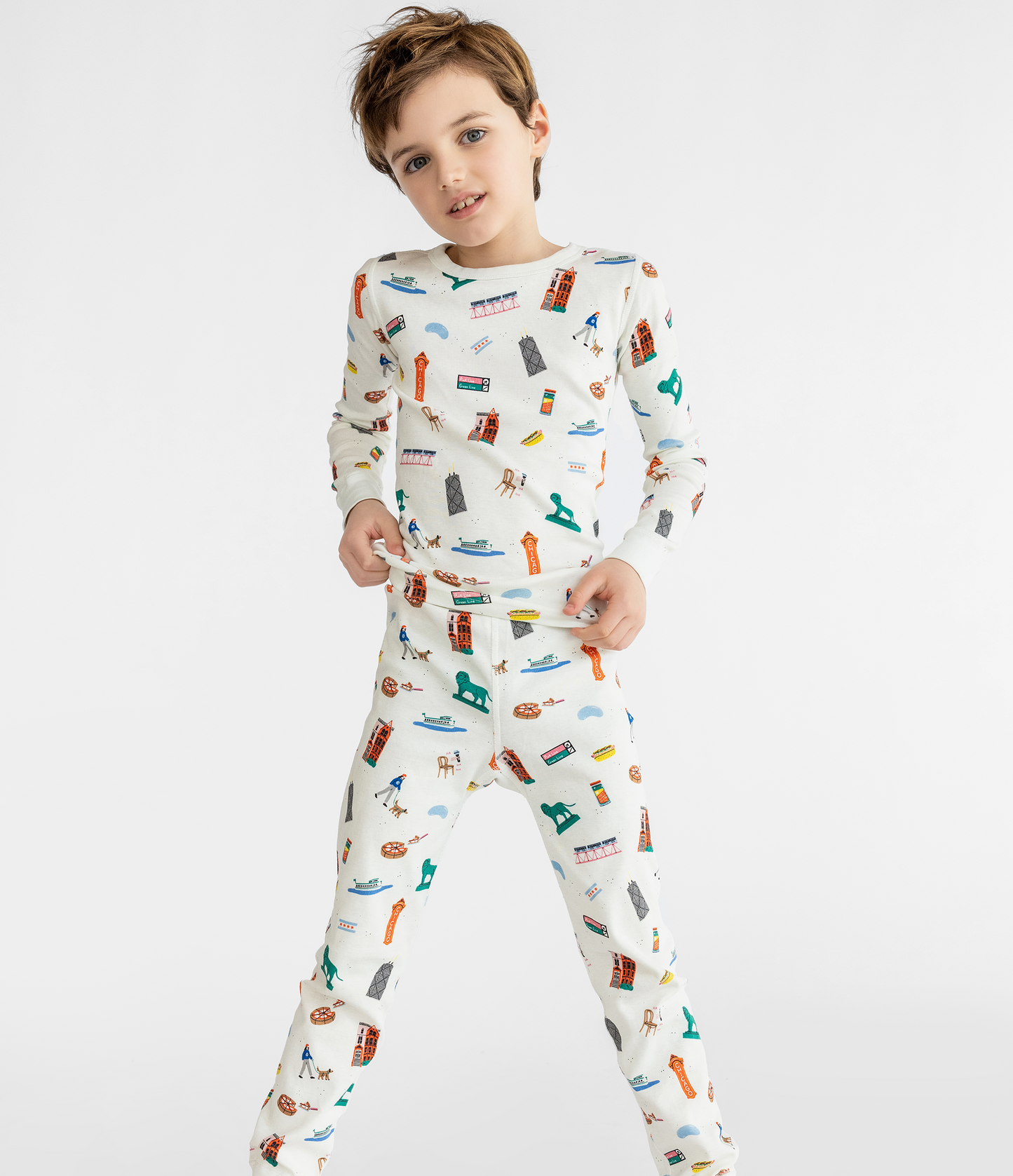Child wearing a Chicago themed pajama set on a white background