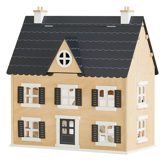 Wooden dollhouse with a black roof on a white background