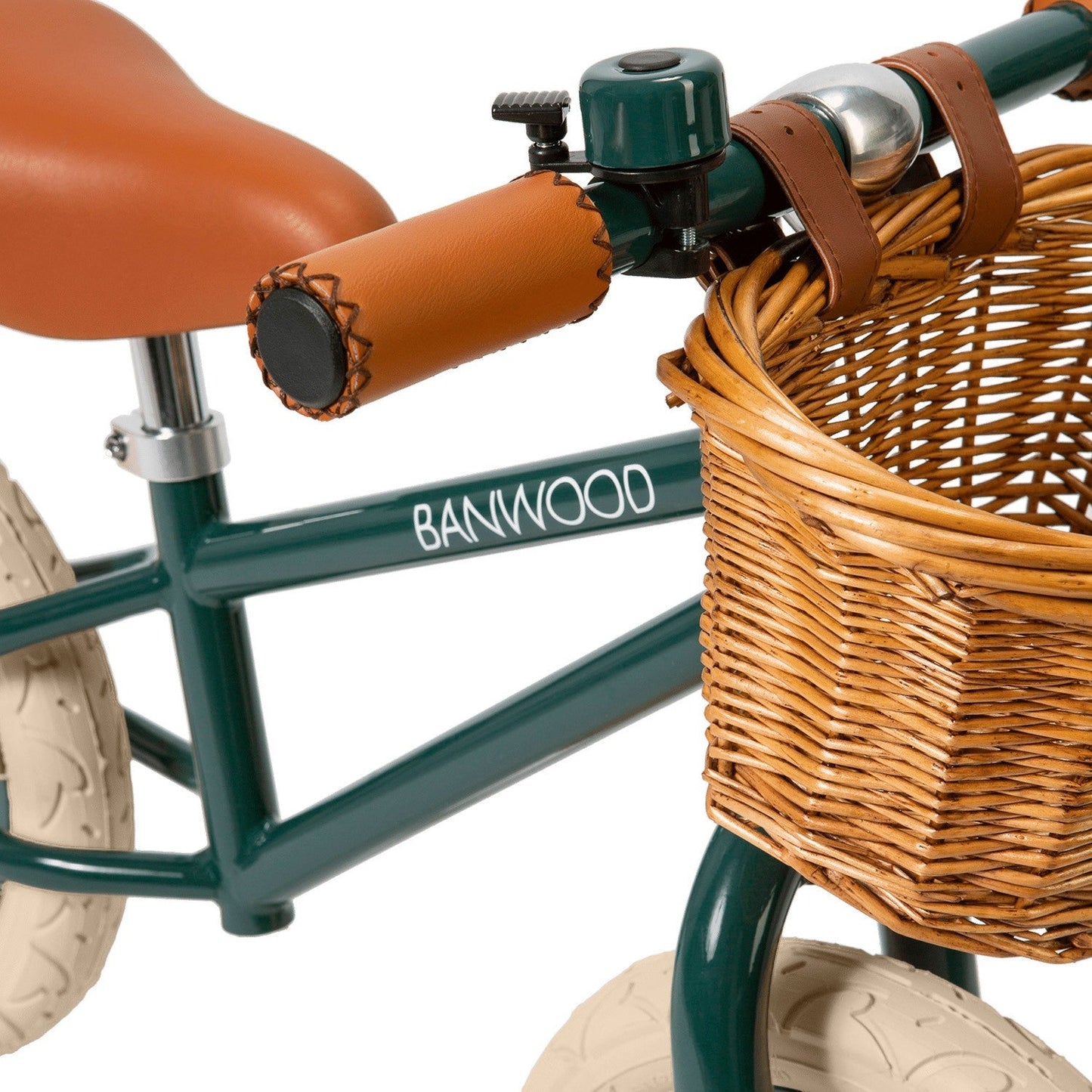 Children's balance bike with wicker basket and Banwood branding on a white background