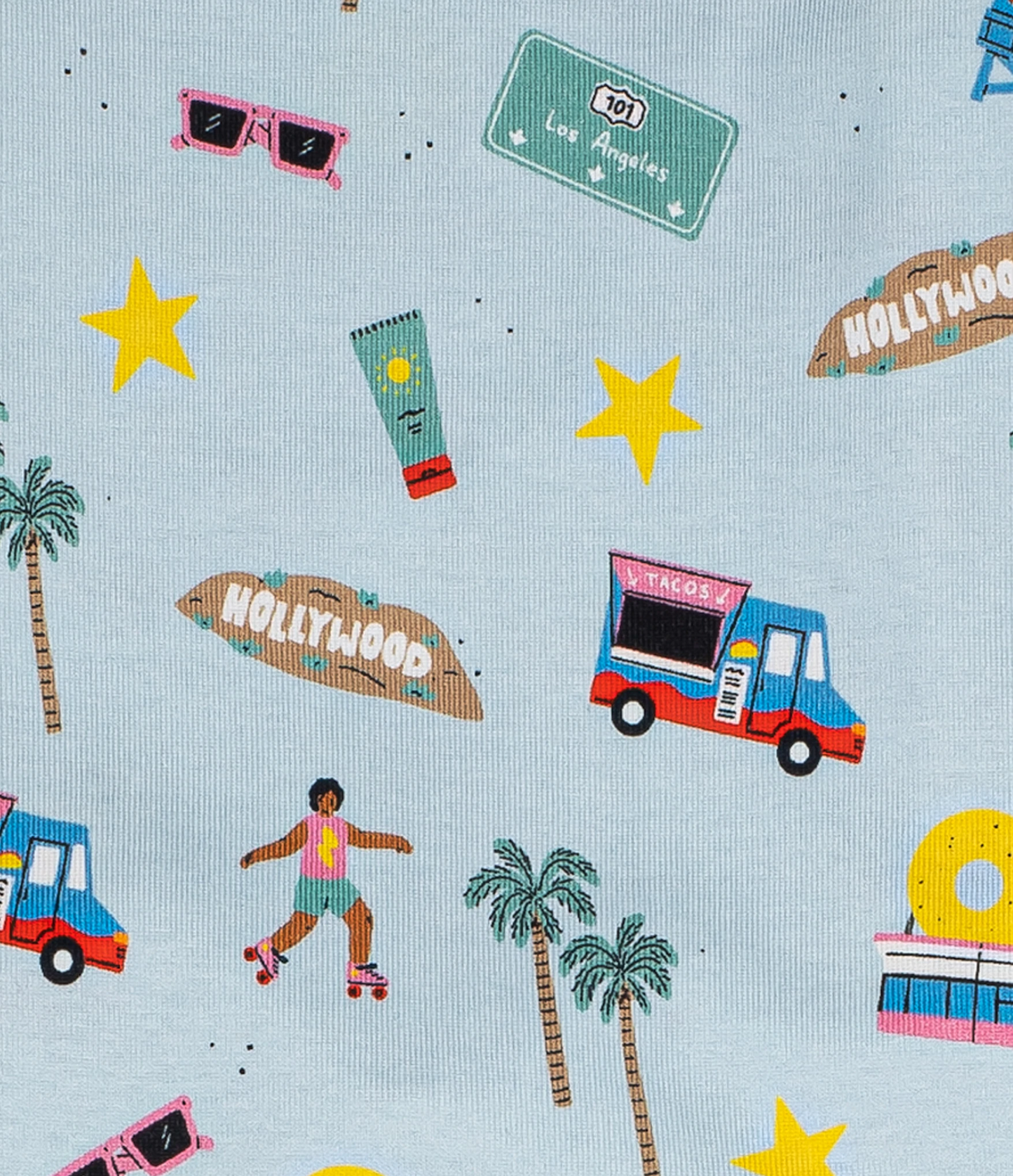 Fabric pattern with palm trees, food trucks, and 'Hollywood' signs on a light blue background.