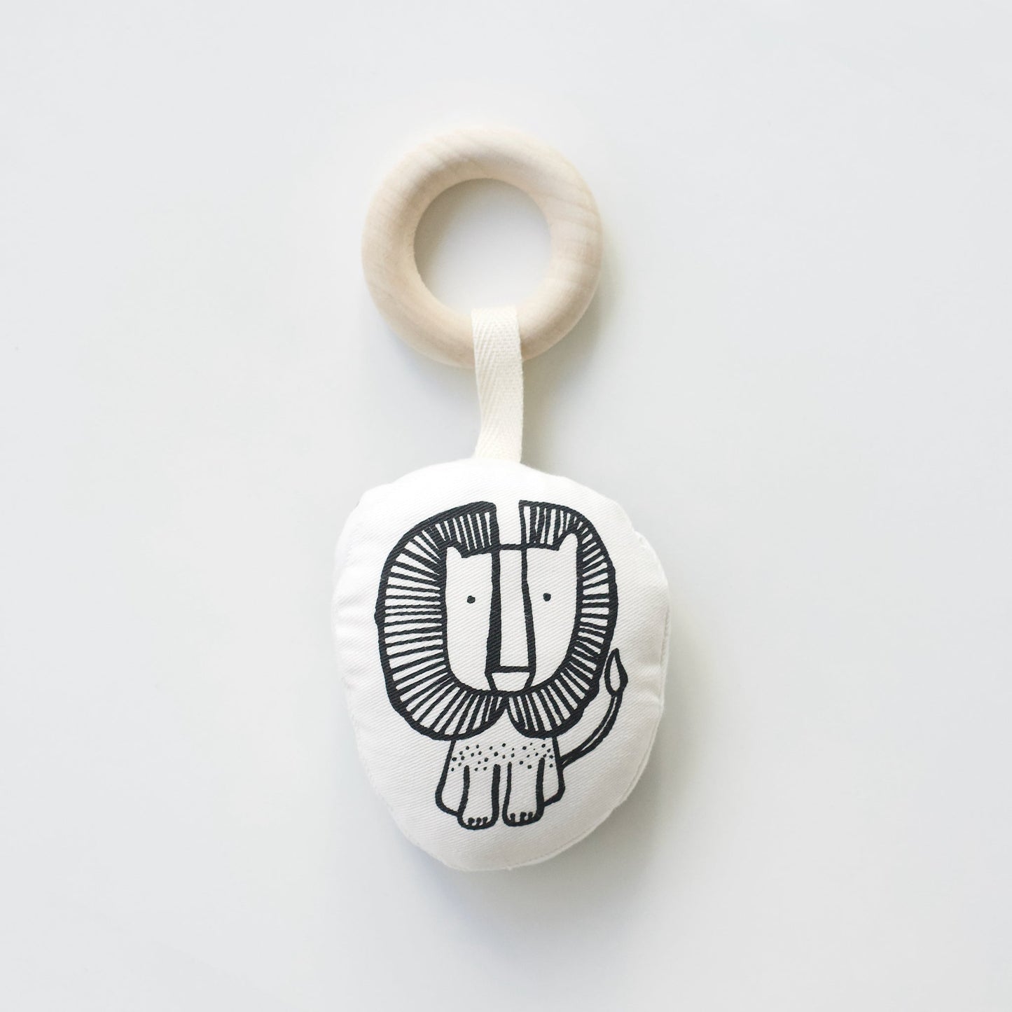 Teething ring with lion design on a white background