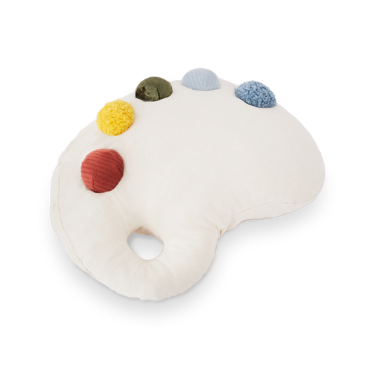 Round plush toy with colorful pom-poms on a white background