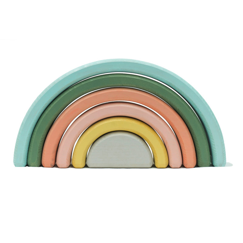Set of colorful wooden rainbow toys on a white background