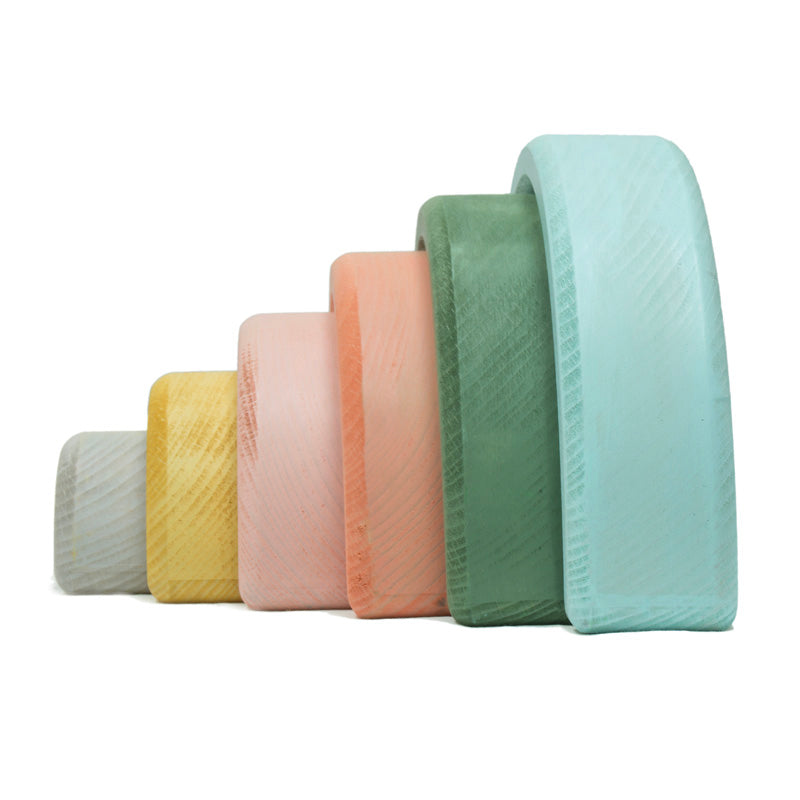 Set of colorful quilted cushions on a white background