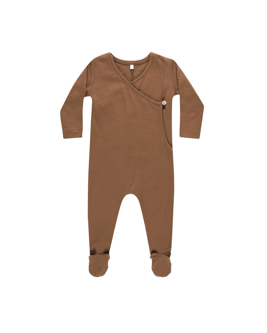 A brown pointelle wrap footie with a snap closure on the interior and button closure on the exterior, displayed against a white background.