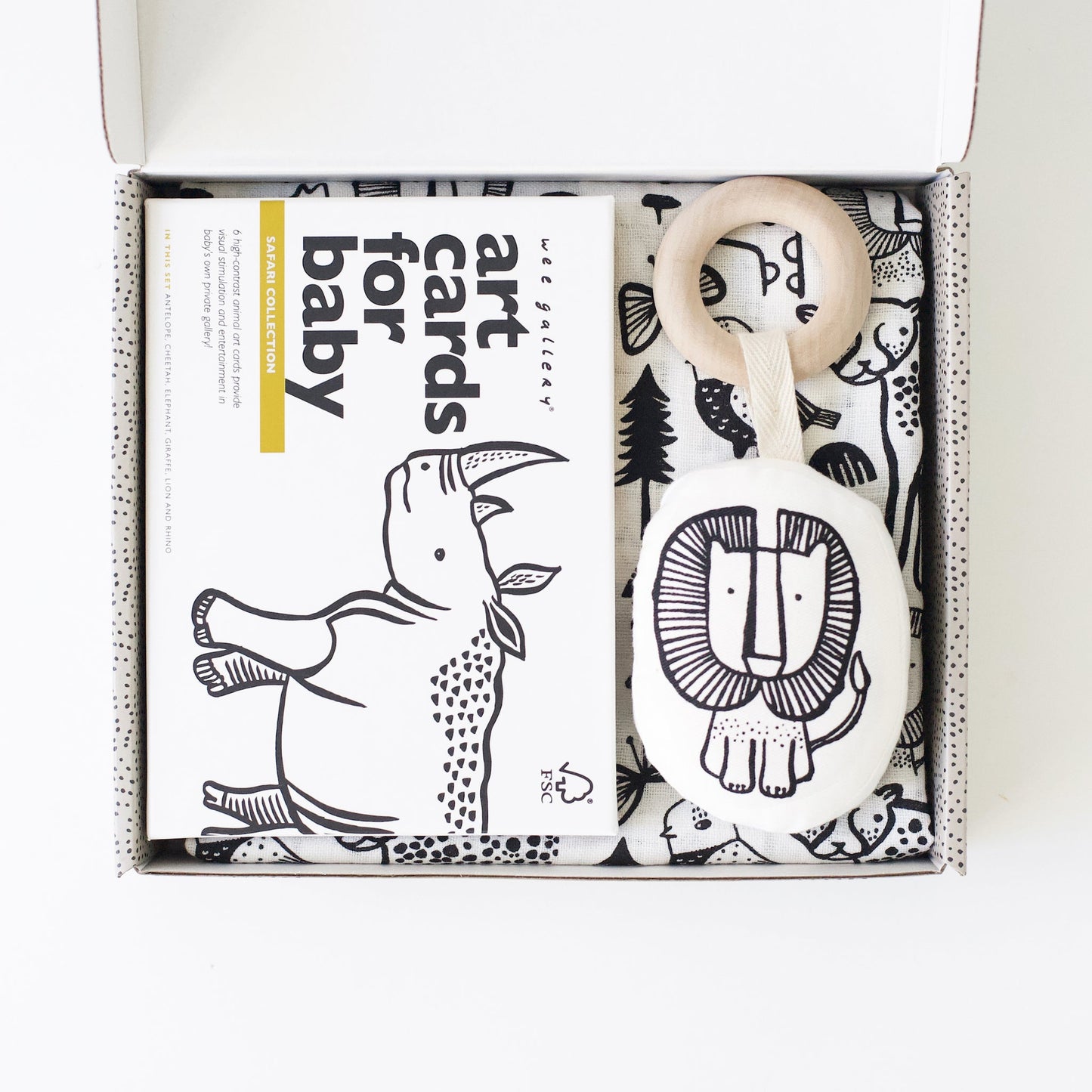 Baby teething ring with lion design and 'art cards for baby' book in a box
