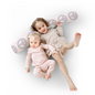 Two children lying on a white surface with a decorative pillow featuring peace signs.