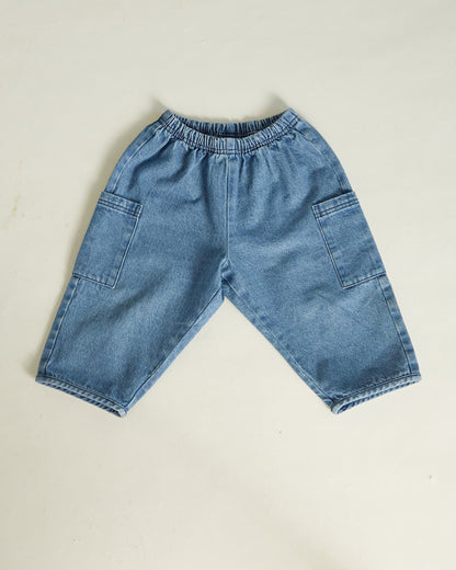 Blue denim shorts on a beige background