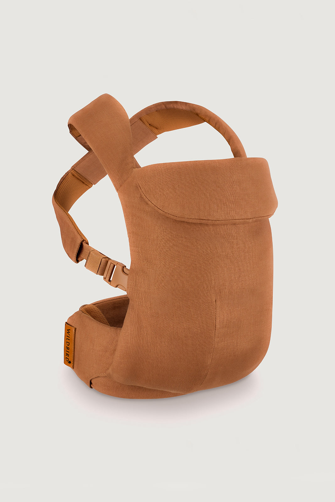 Brown baby carrier on a light gray background