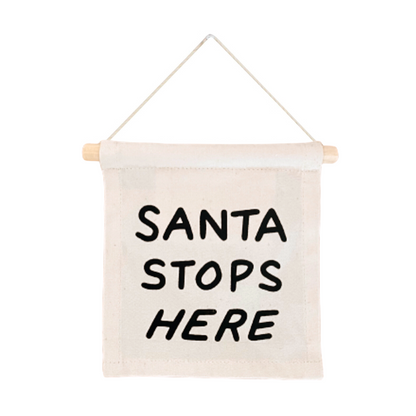 Hanging banner with 'Santa Stops Here' text on a white background