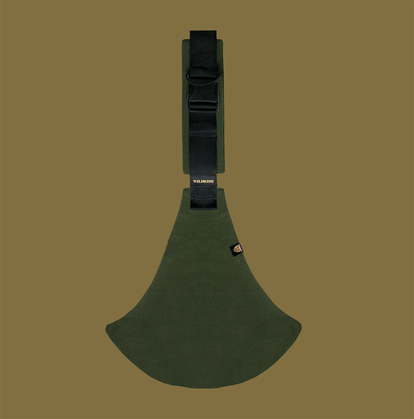 Green toddler carrier on a brown background