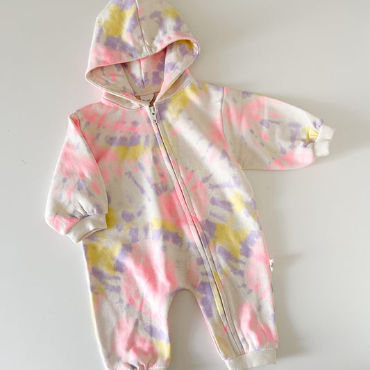 Tie-dye baby onesie with a hood on a white background