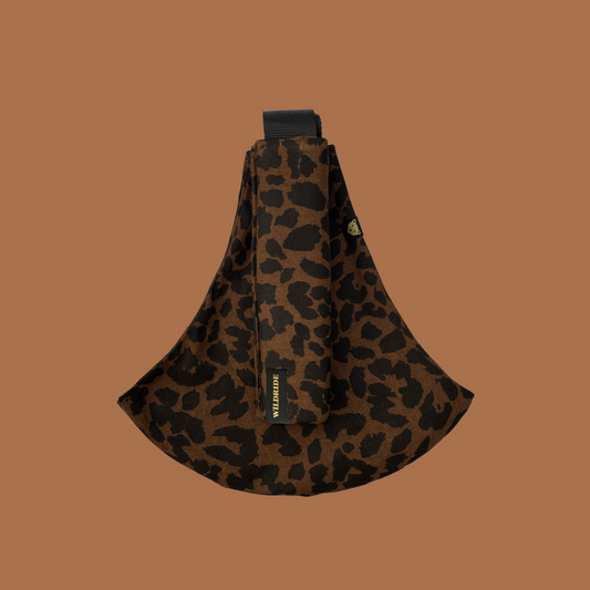 Leopard print bag on a brown background