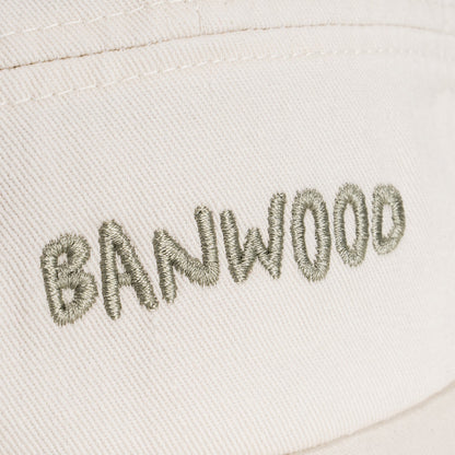 Embroidered text 'BANWOOD' on a light fabric background