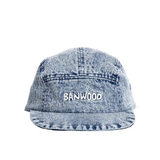 Blue denim cap with 'BANWOOD' embroidery on a white background