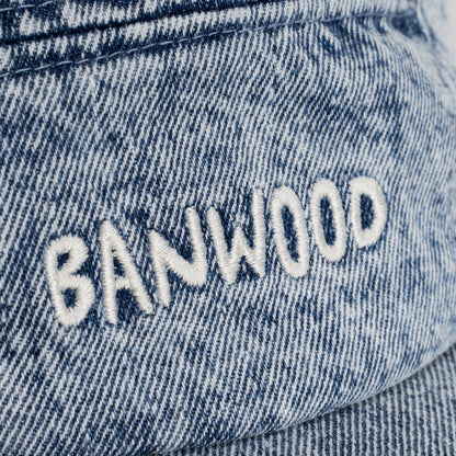 Close-up of denim fabric with 'BANWOOD' embroidery