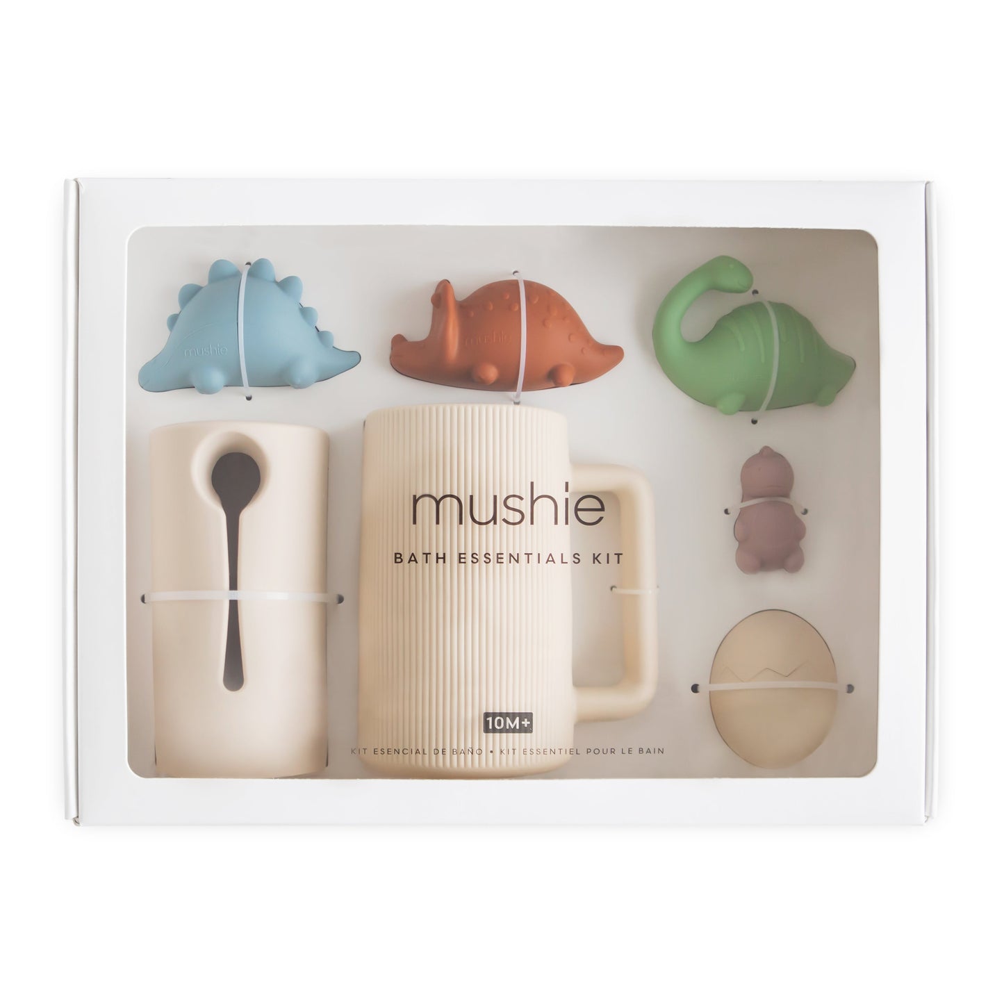 Mushie bath essentials kit with various bath toys in packaging on a white background