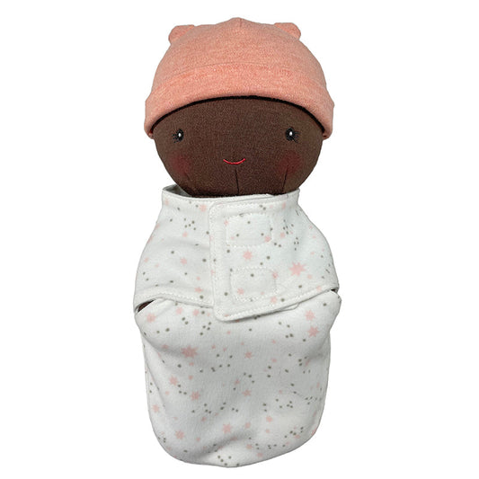 Stuffed toy wrapped in a blanket with a pink hat on a white background