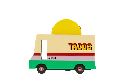 Toy taco truck with a yellow roof and green base on a white background