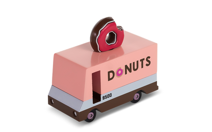 Toy donut truck with a donut on top on a white background