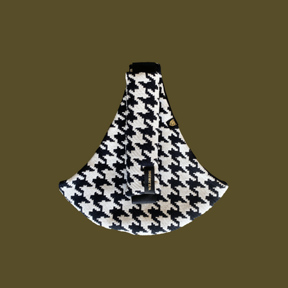 Houndstooth patterned product on a brown background