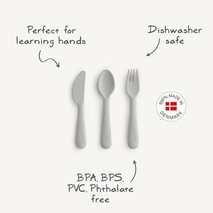 Children's cutlery set with text highlighting features on a white background